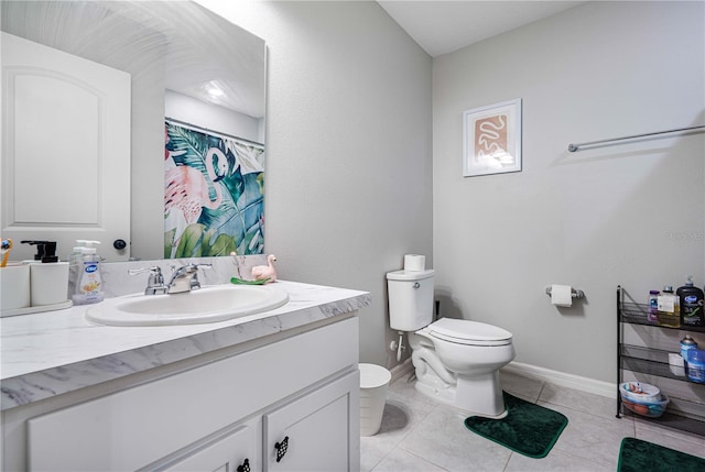 bathroom featuring walk in shower, tile patterned flooring, vanity, and toilet