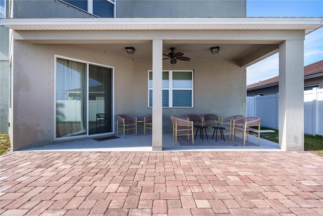 view of patio featuring ceiling fan