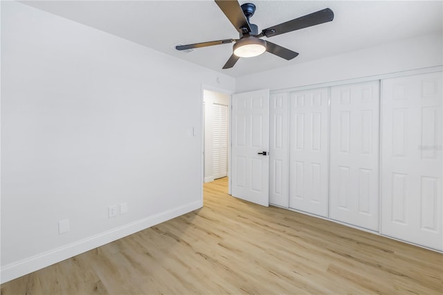 unfurnished bedroom with a closet, ceiling fan, and light wood-type flooring