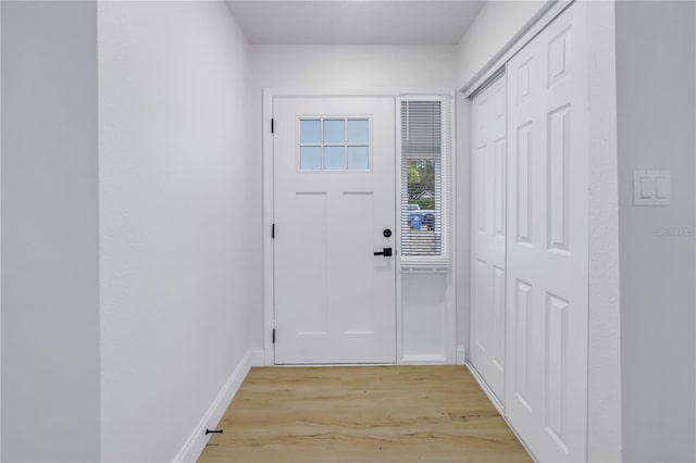 doorway to outside with light wood-type flooring