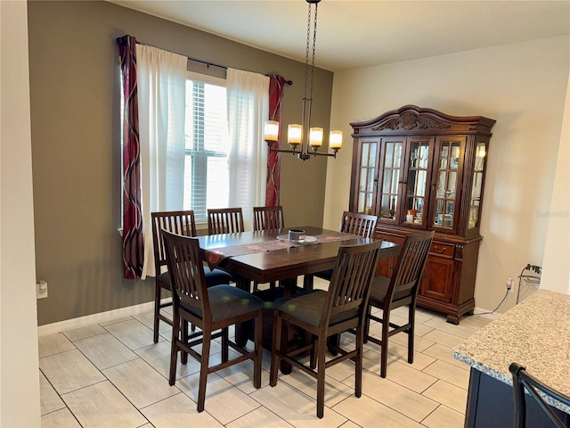 dining space with a notable chandelier