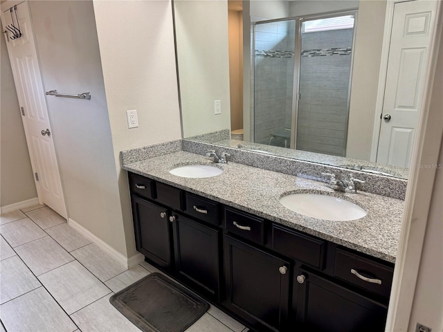 bathroom featuring tile patterned flooring, vanity, walk in shower, and toilet