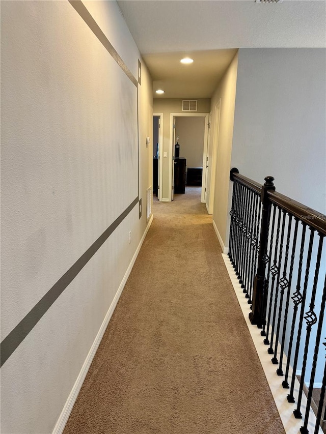 hallway with light carpet