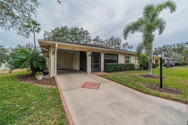 ranch-style house with a front yard and a carport