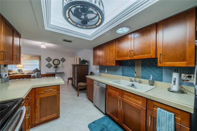 kitchen with ornamental molding, stainless steel appliances, backsplash, and sink