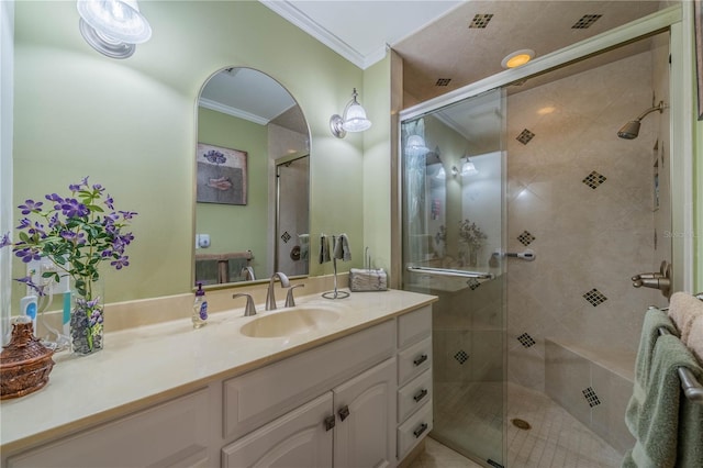 bathroom featuring vanity, walk in shower, and crown molding