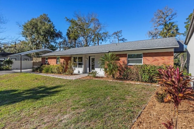 ranch-style home featuring a front yard