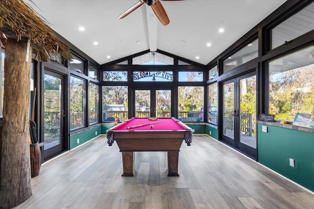 rec room with ceiling fan, french doors, light hardwood / wood-style flooring, billiards, and lofted ceiling