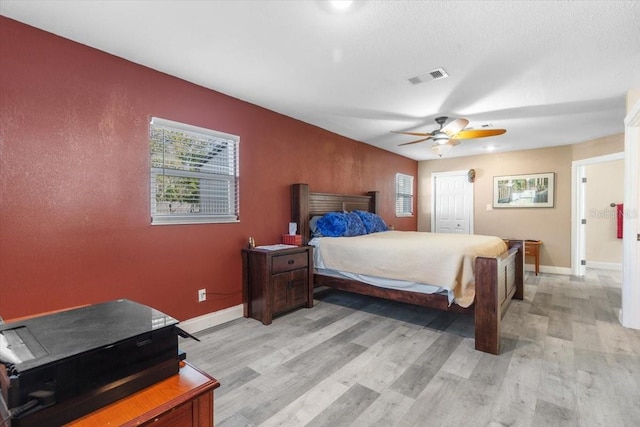 bedroom featuring ceiling fan and light wood-type flooring