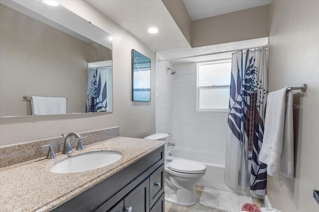 full bathroom featuring vanity, toilet, and shower / bath combo with shower curtain