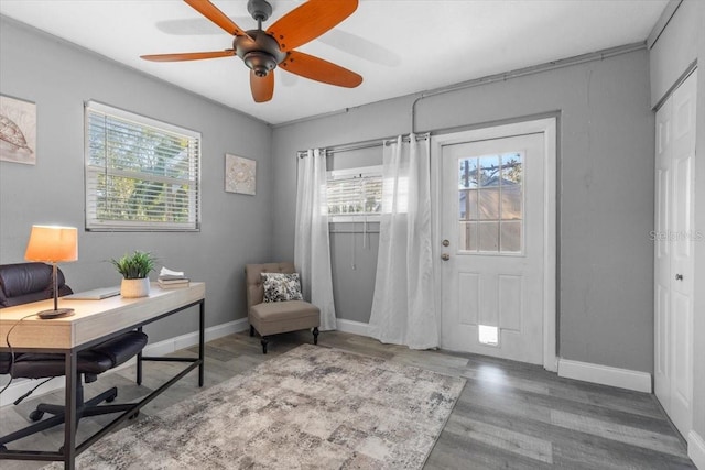 office with hardwood / wood-style flooring and ceiling fan