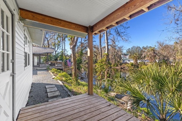 wooden deck with a water view