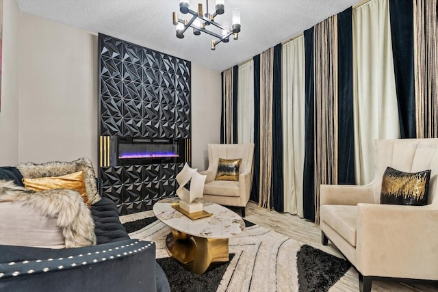 living area featuring a notable chandelier and a textured ceiling