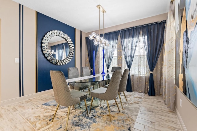 dining space with an inviting chandelier