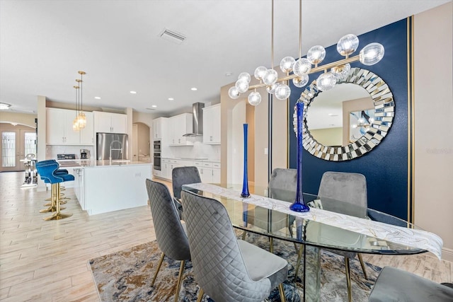 dining room with light hardwood / wood-style flooring