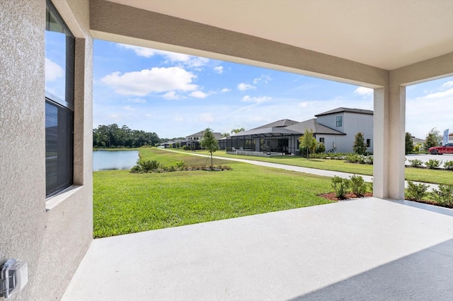 view of patio with a water view