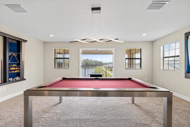 game room with billiards, a textured ceiling, and carpet flooring