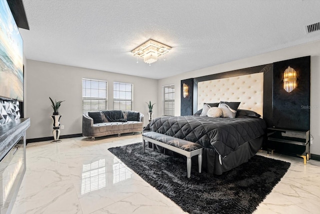 bedroom featuring a textured ceiling