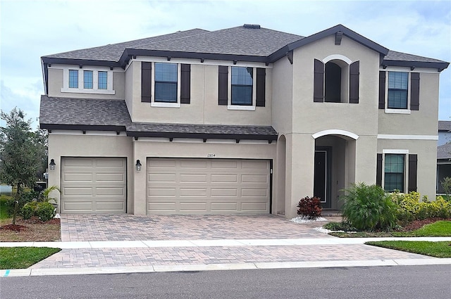 view of front of property with a garage