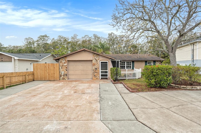 ranch-style house featuring a garage