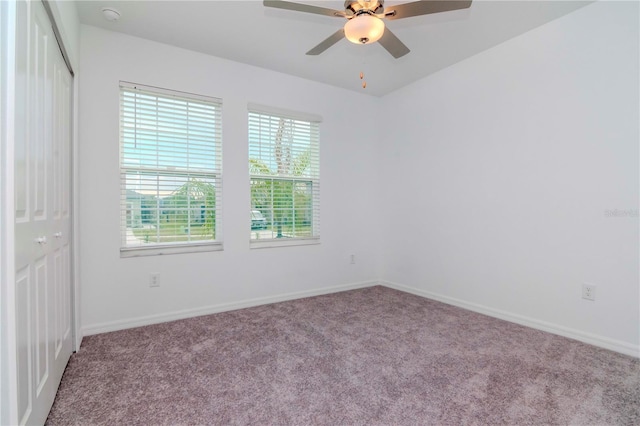 unfurnished room featuring light carpet and ceiling fan