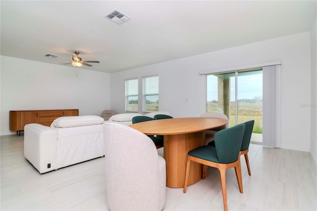 dining area with ceiling fan and a wealth of natural light