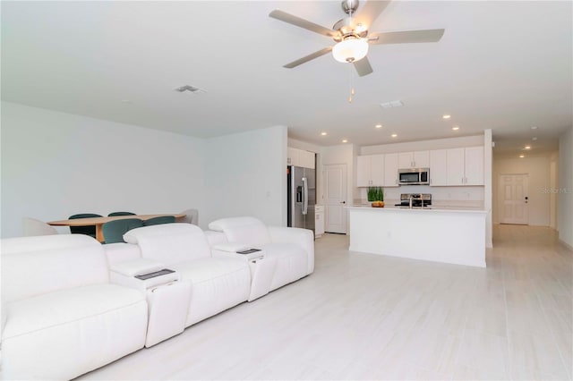 living room featuring ceiling fan