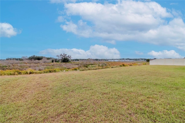 view of yard with a rural view