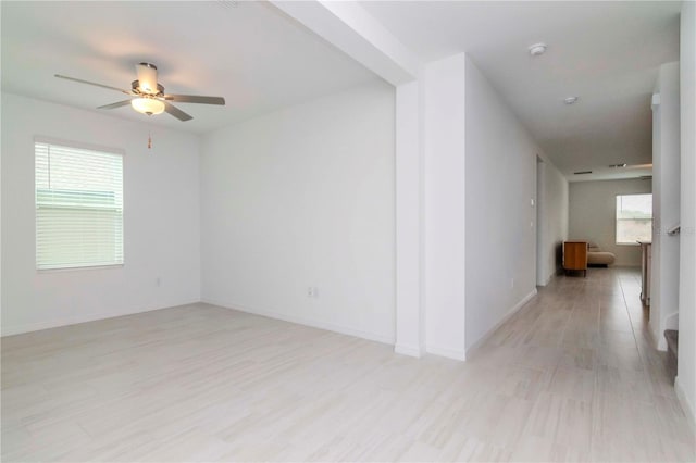 11307 Linden Depot Rd, San Antonio, FL 33576 - spare room featuring ceiling fan, light wood-style flooring, and a smoke detector