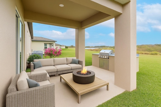 11307 Linden Depot Rd, San Antonio, FL 33576 - view of patio with an outdoor living space with a fire pit and area for grilling