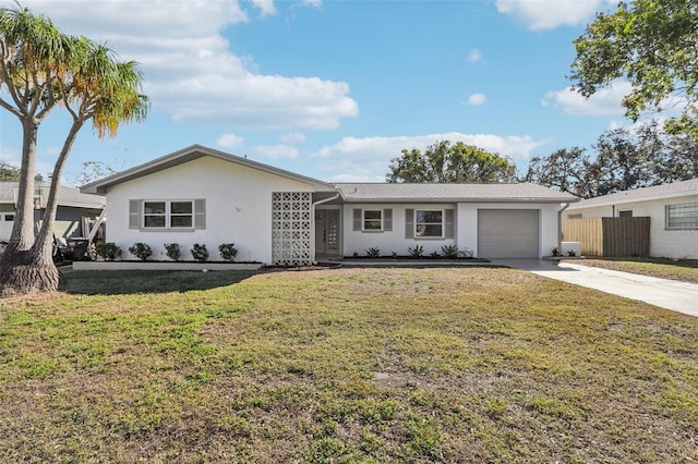 ranch-style home featuring a garage and a front lawn