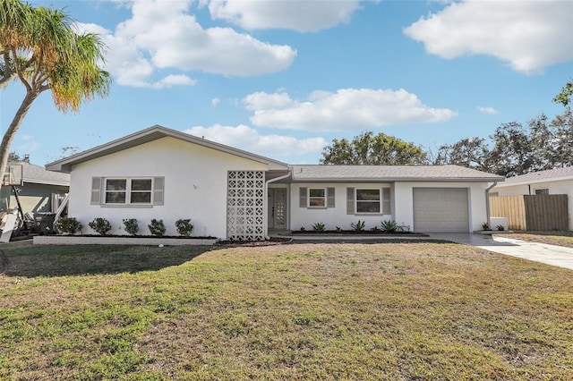 ranch-style house with a garage and a front yard