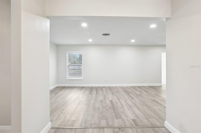 unfurnished room with light hardwood / wood-style flooring