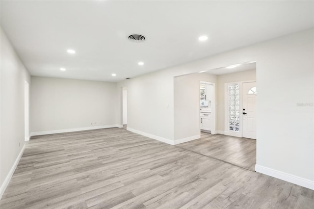 unfurnished room featuring light hardwood / wood-style floors