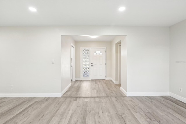 entryway with light hardwood / wood-style floors