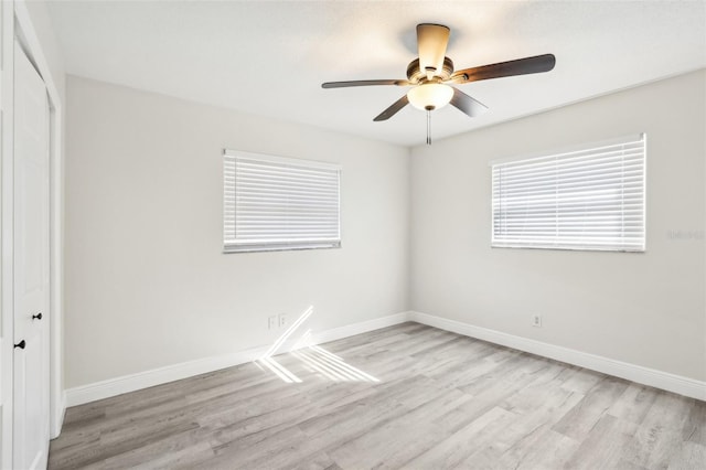 unfurnished room featuring light wood-type flooring and ceiling fan