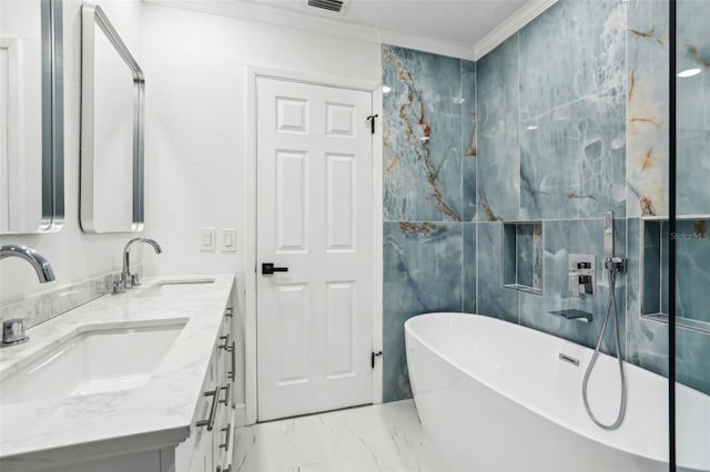 bathroom with a washtub, crown molding, and vanity