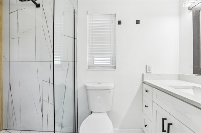 bathroom with walk in shower, vanity, and toilet