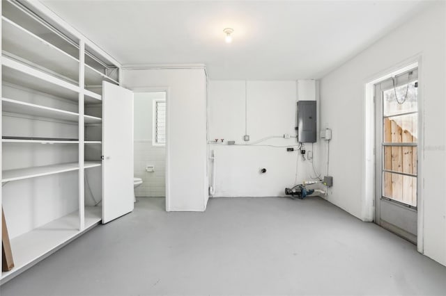 unfurnished room featuring electric panel