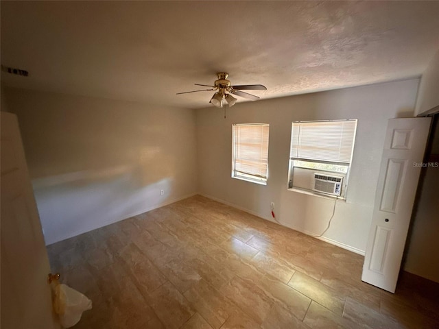 unfurnished bedroom with ceiling fan and cooling unit