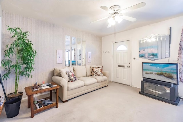 carpeted living room featuring ceiling fan