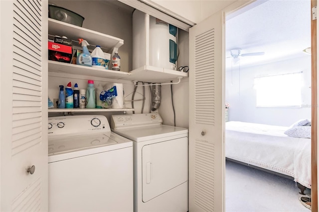 clothes washing area featuring washer and dryer