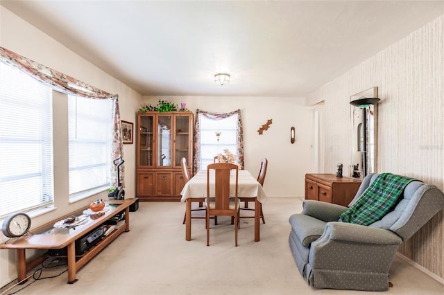 dining room featuring light colored carpet