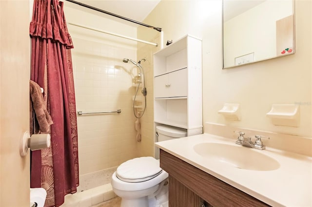 bathroom with vanity, toilet, and curtained shower