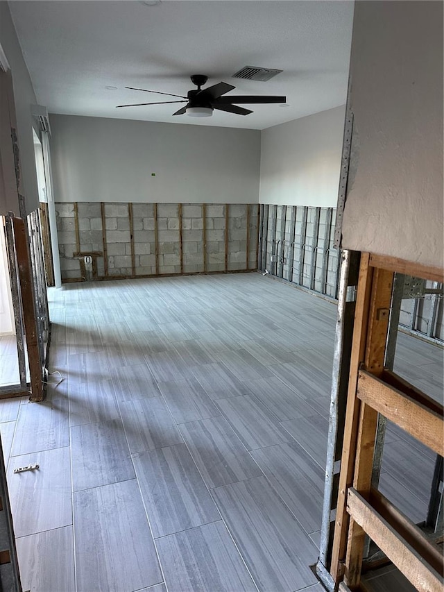 spare room featuring ceiling fan and hardwood / wood-style floors