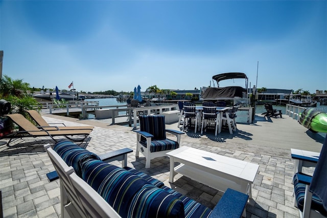 view of patio / terrace featuring a water view and an outdoor living space