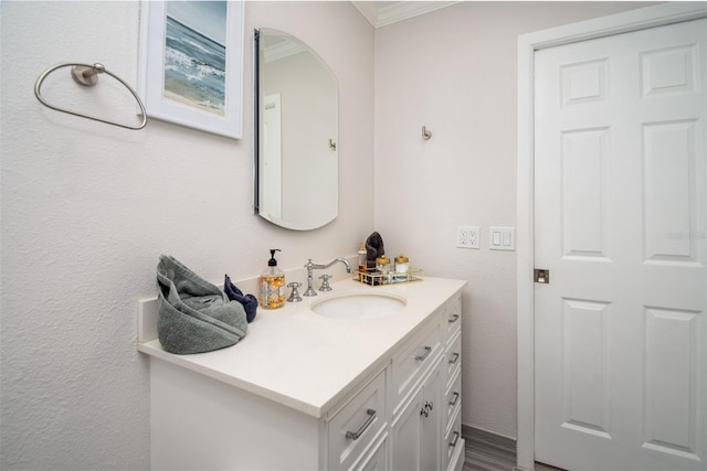 bathroom featuring vanity and ornamental molding