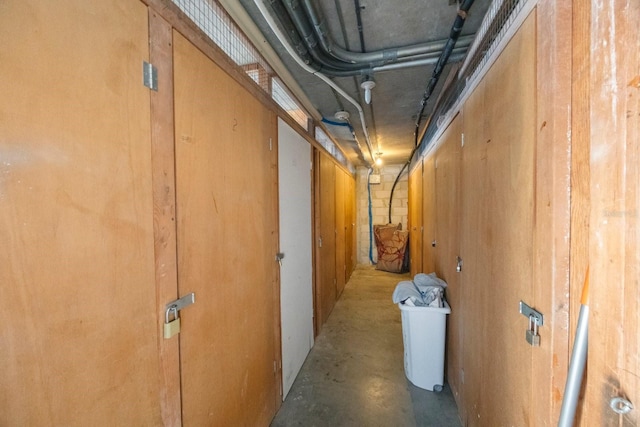 hallway with concrete floors