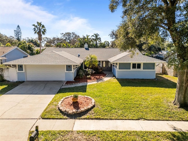 single story home featuring a garage and a front lawn