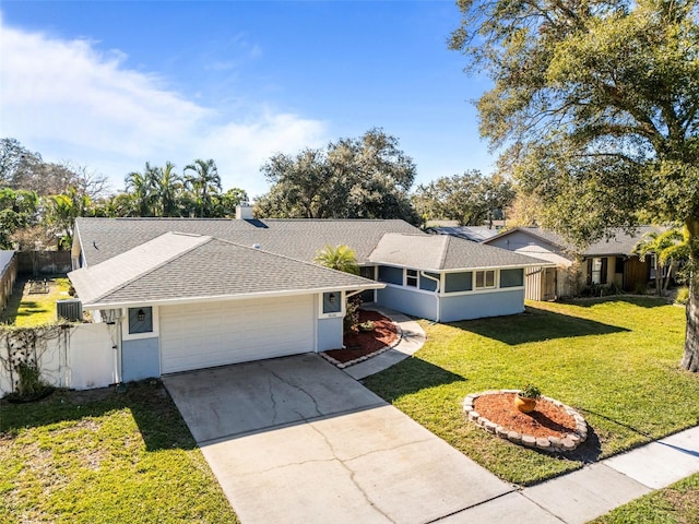 ranch-style home with central AC, a front lawn, and a garage